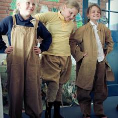 Girls trying out Women's Land Army clothes